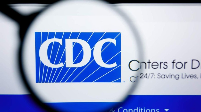 CDC logo under magnifying glass