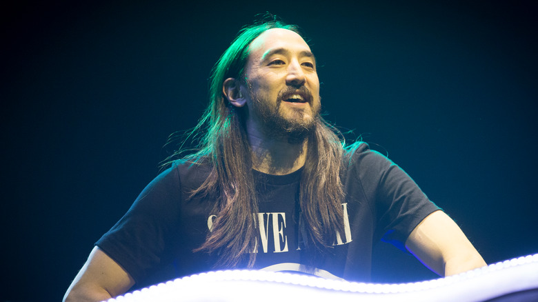 Steve Aoki performs on stage