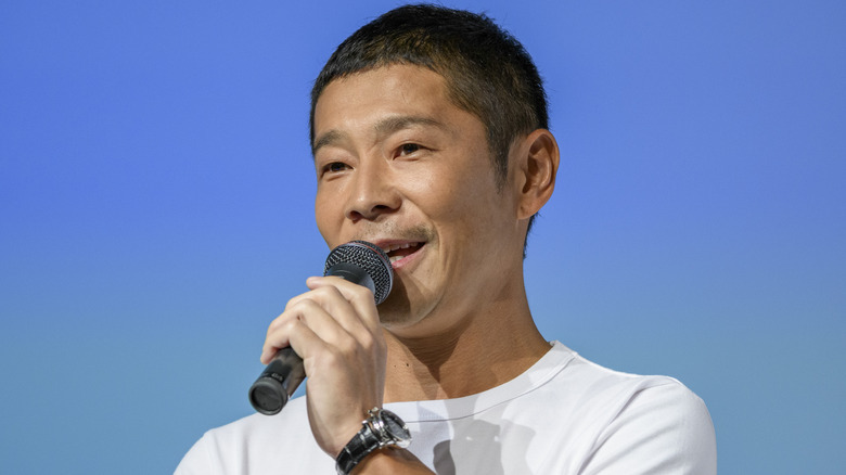 Yusaku Maezawa at a conference