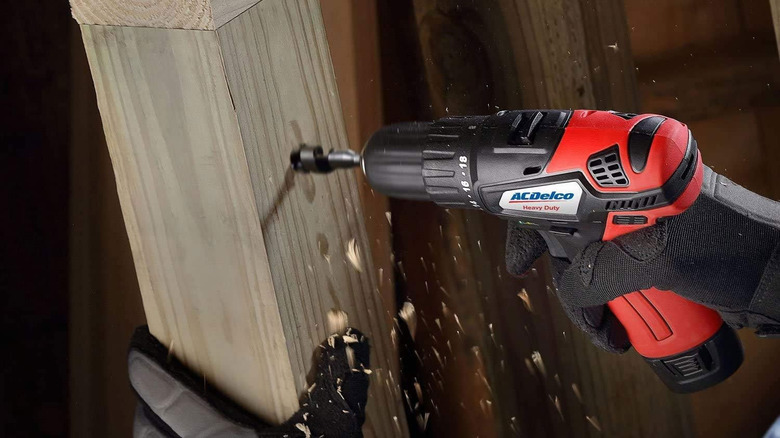 ACDelco drill drilling into wood plank