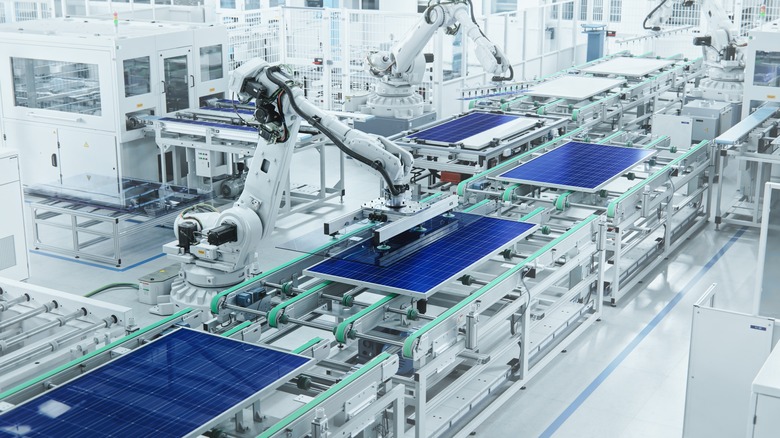 bright solar panels being built by robot