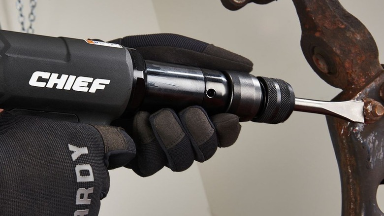 Worker using Chief air hammer