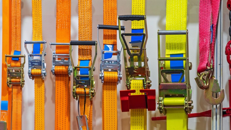 A bunch of ratchet straps in a row