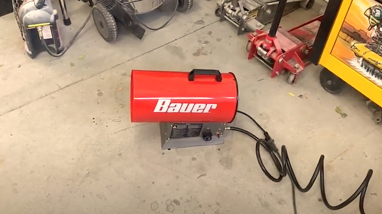 Bauer Torpedo Heater being used to heat garage