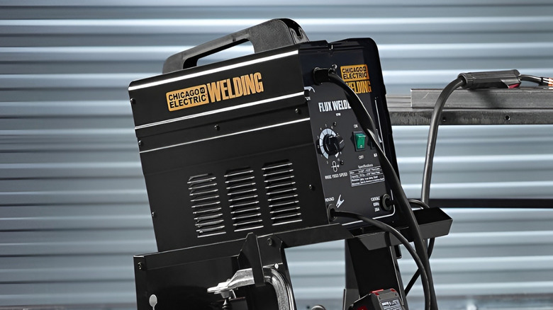 Chicago Electric welding cart supporting items