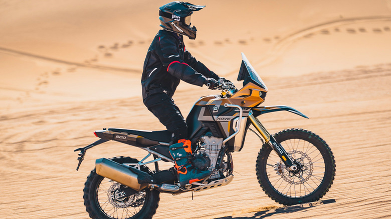 Kove 800x rally motorcycle with rider in sand dunes