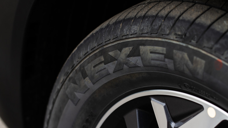 A close-up shot of a Nexen-branded tire