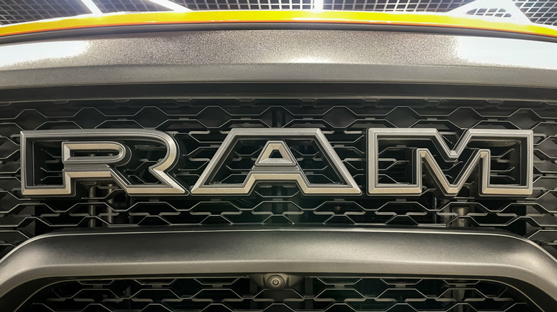 The Ram brand/logo displayed on the front grille of a truck