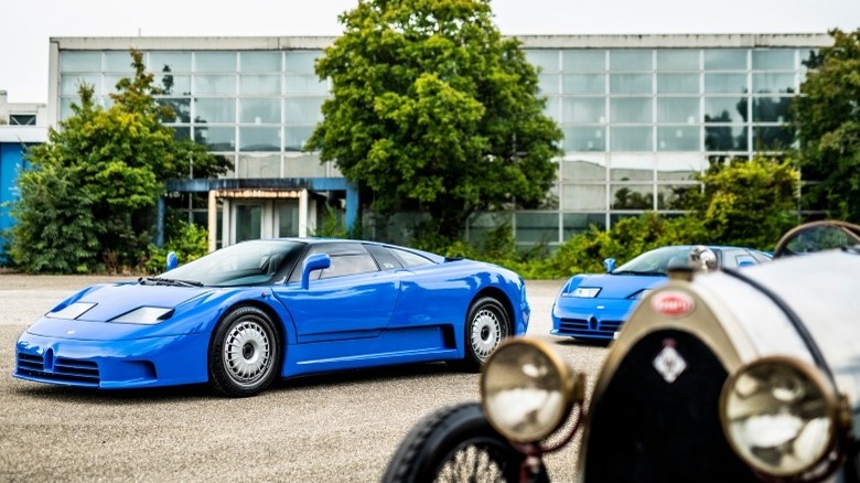 A blue Bugatti EB110 parked within the company's Campogalliano factory