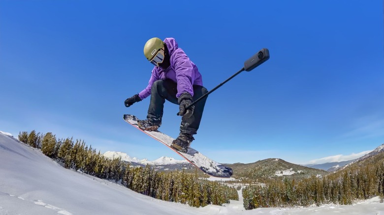 Insta360 camera being used in action by snowboarder.