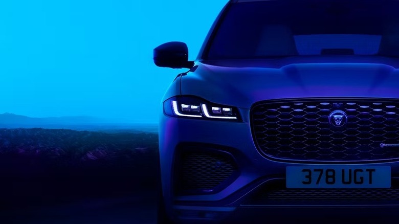 Jaguar F-PACE facing forward in a blue background