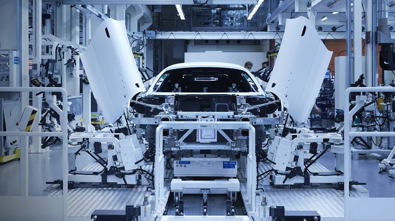 A Maserati being constructed within a factory.