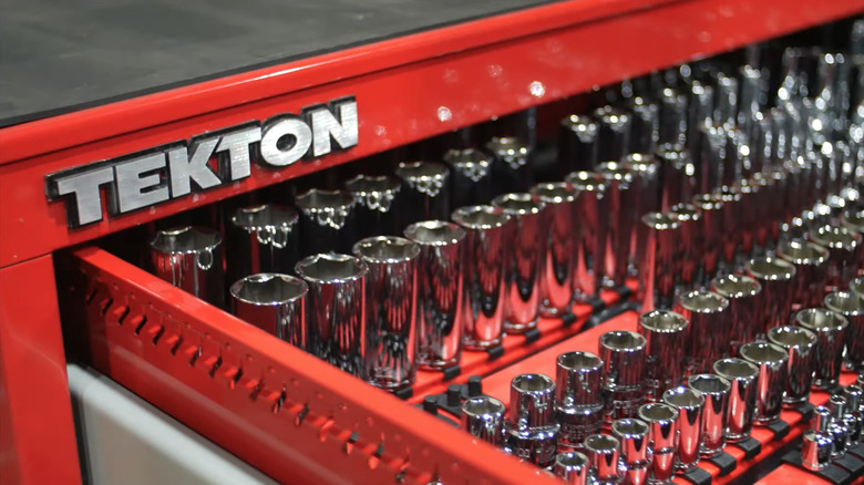 A Tekton Tools cabinet opened with parts displayed.