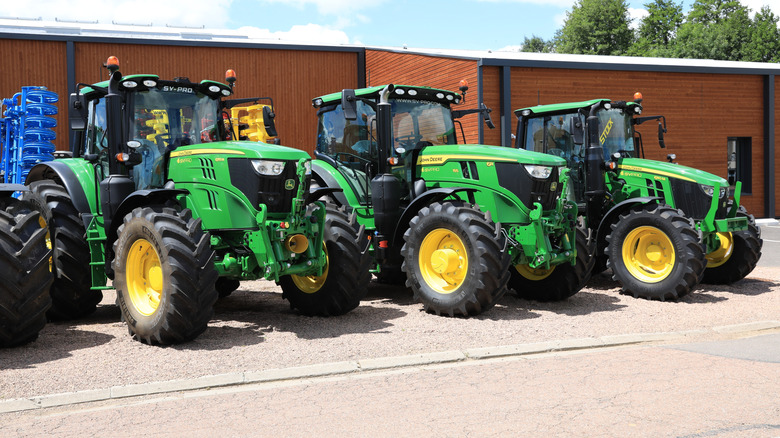 John Deere tractors in a row