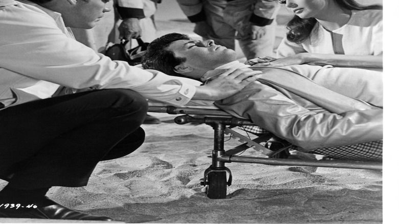 Mickey Thompson injured while racing his car in Death Valley in a scene from 1964's "The Lively Set." Thompson played himself in the film that starred James Darren and Pamela Tiffin.