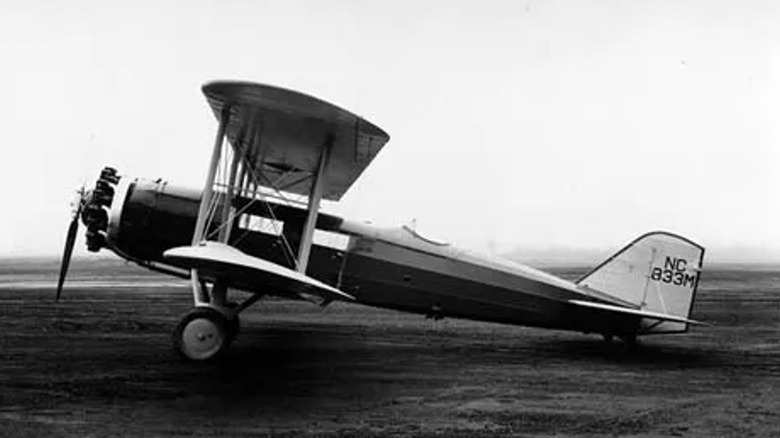 A black and white photograph of a landed Boeing Model 40A mail plane.