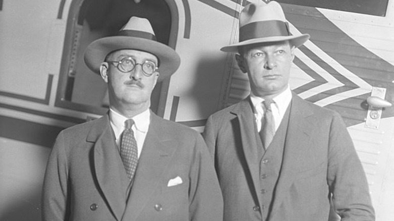 William E. Boeing and Fred Rentschler standing in front of an airplane.