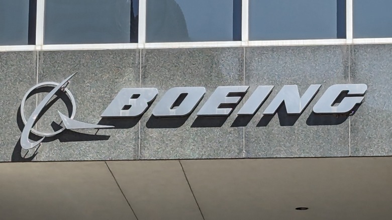 The Boeing logo on the side of a concrete building.