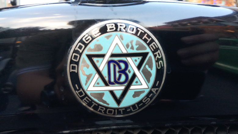 Closeup photo of the vintage Dodge Brothers logo emblem metal badge.