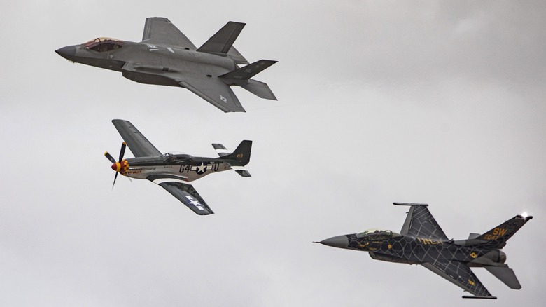 an assortment of American fighter jets from different generations