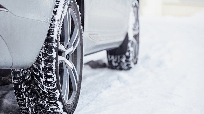 Car driving over snow