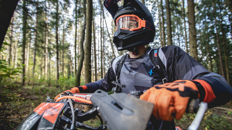 Motocross rider in forest