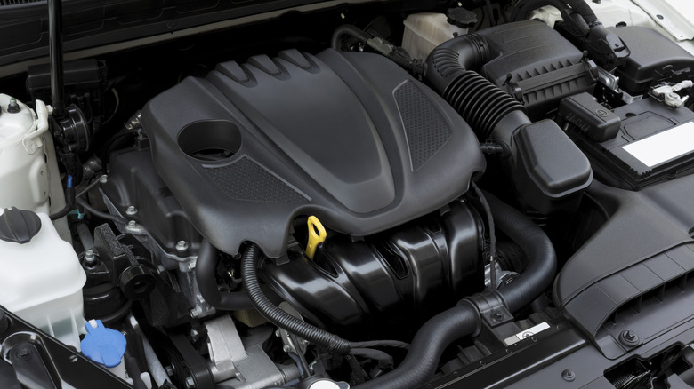 Car engine under open hood