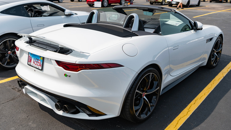 Jaguar F-Type convertible parked in a dealership lot