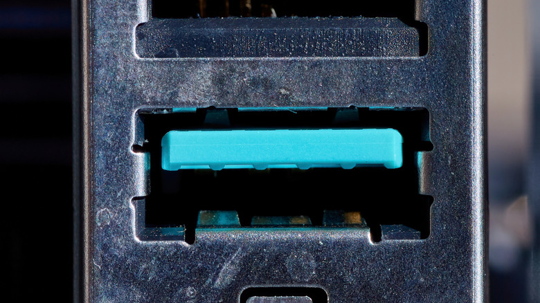 Close up of a teal USB port