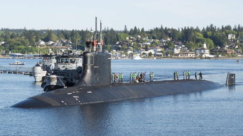 Submariners standing on top of the USS Connecticut in Washington in May 2018