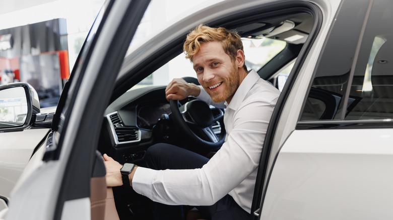 happy man driving a car