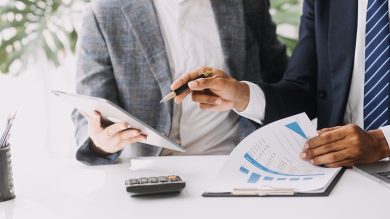 two people doing finances