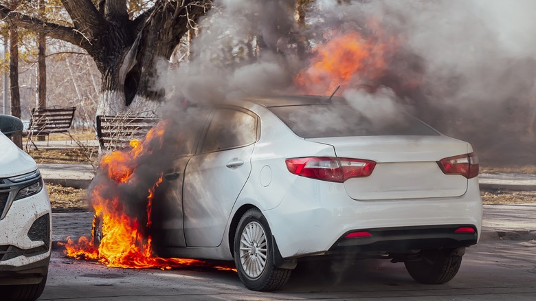 car burning in parking lot