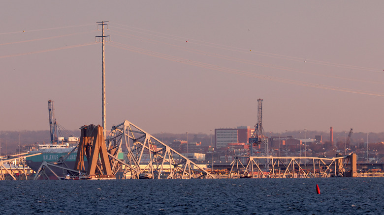 Broken Francis Scott Key bridge at sunset