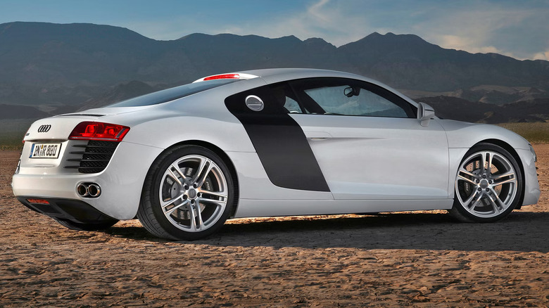 Passenger side view of first-gen Audi R8 parked in desert