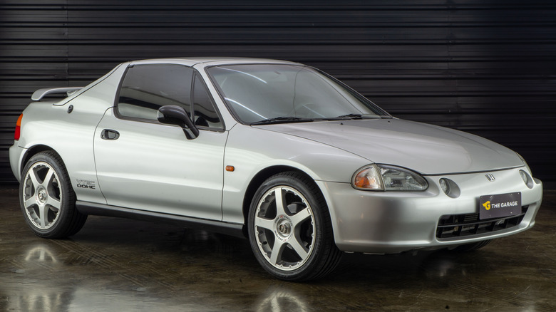 Silver Honda Del Sol parked front quarter view