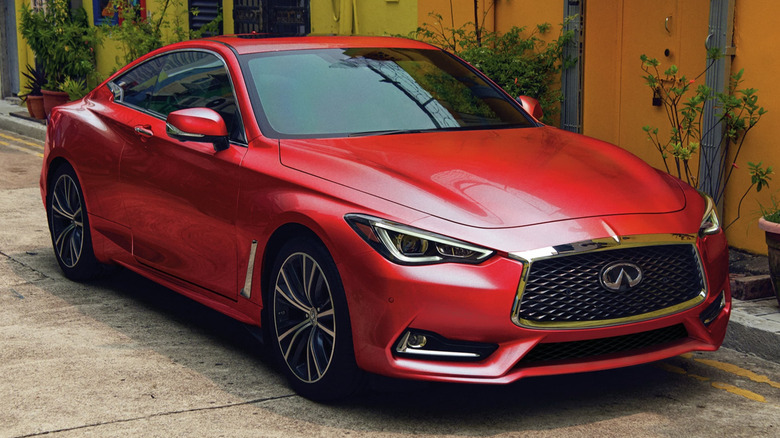 Red Infiniti Q60 Sedan parked on street