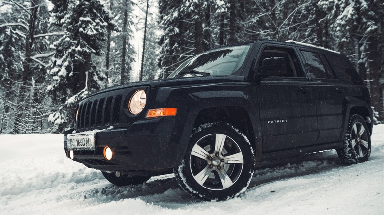 Black Jeep Patriot in snow