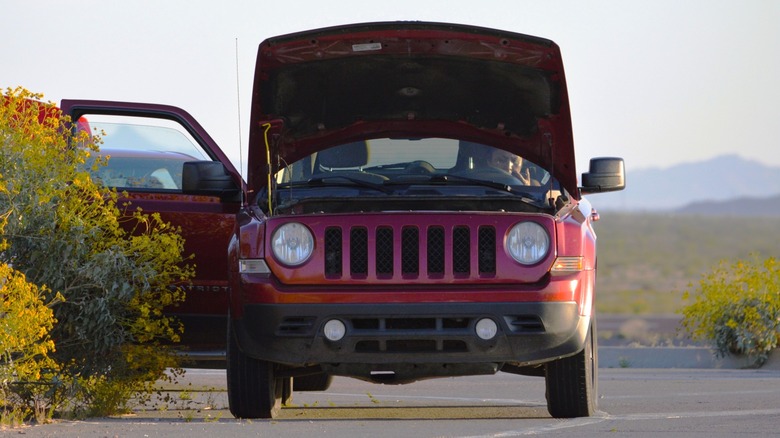 Red Jeep Patriot hood open