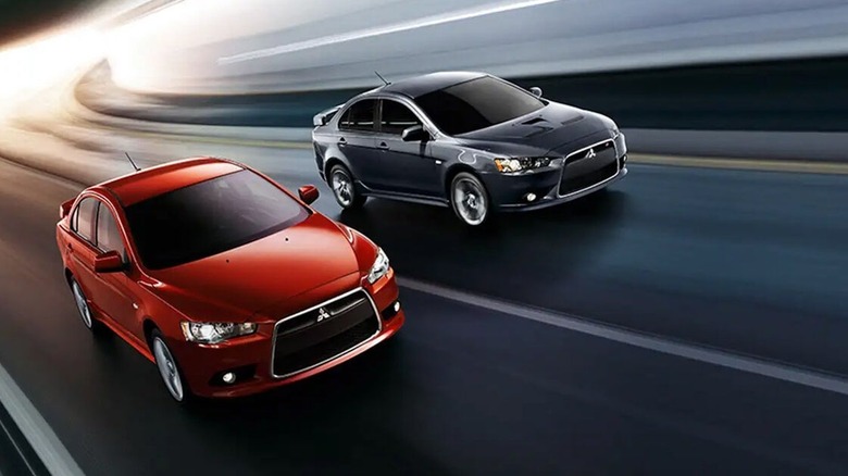 Mitsubishi Lancer & Lancer Evolution driving side by side