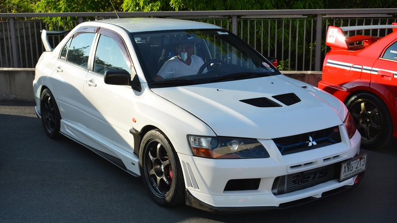 A white Mitsubishi Lancer Evolution