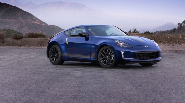 2019 Nissan 370Z Heritage Edition parked on a pavement with mountains in the background