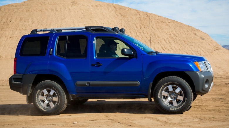 A 2005 Nissan Xterra in the sand.