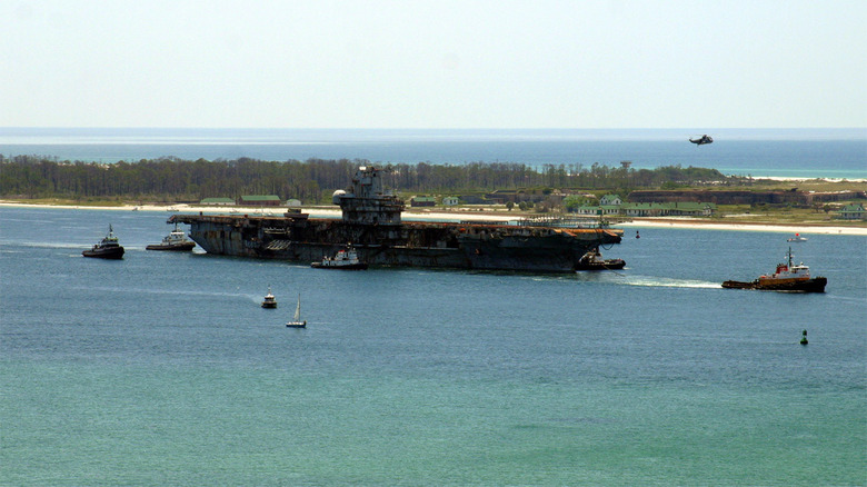 USS Oriskany being towed to final resting place