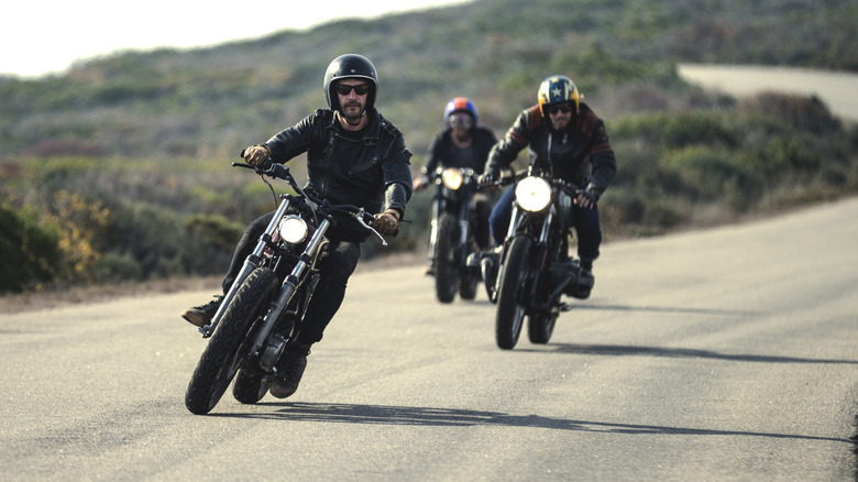 Three bikers riding together on the open road