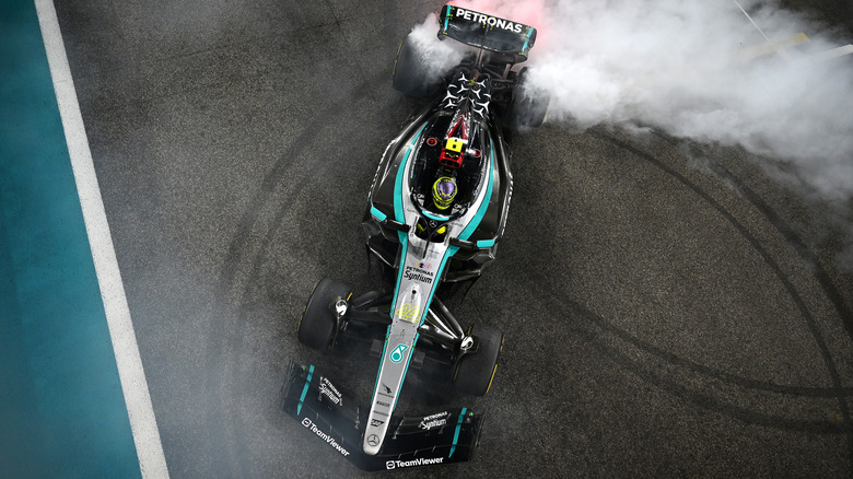 Formula 1 car  doing donuts on track