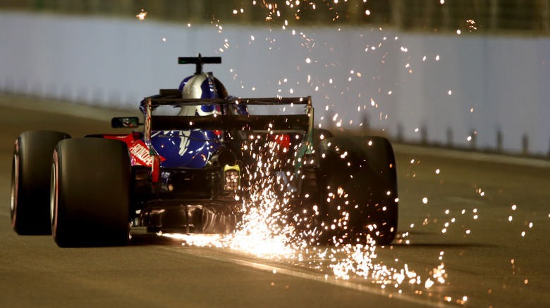 Formula 1 car with sparks on the track