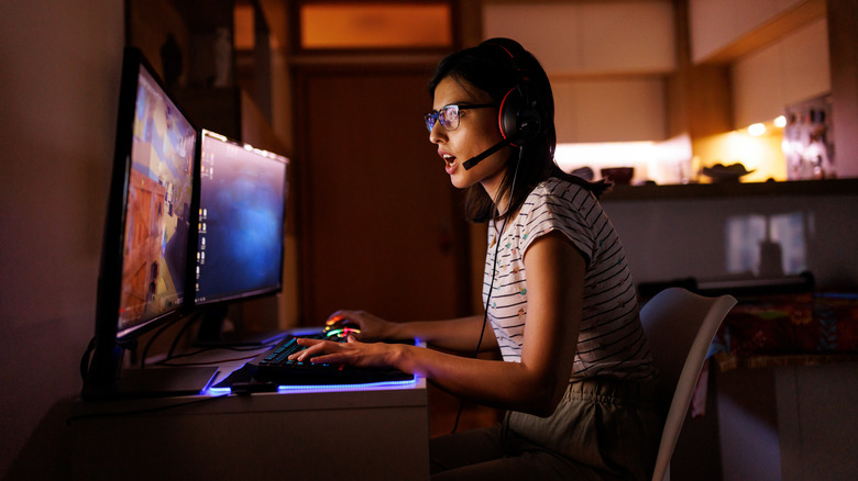 woman with glasses gaming