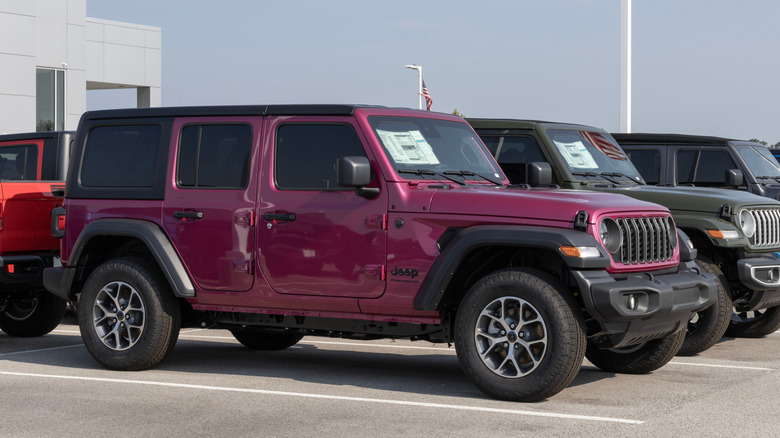 Jeep Wranglers parked outside a dealership