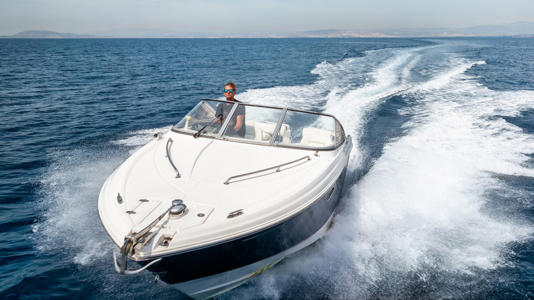 Man driving a speed boat